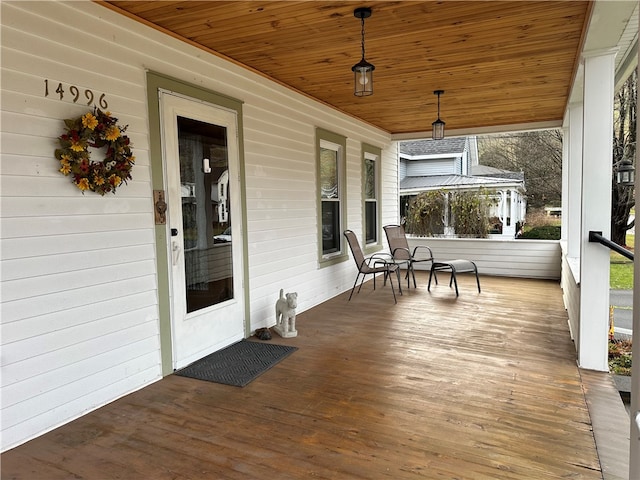 wooden terrace with covered porch