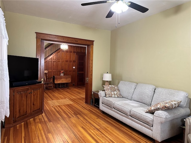 living room with ceiling fan and light wood-type flooring