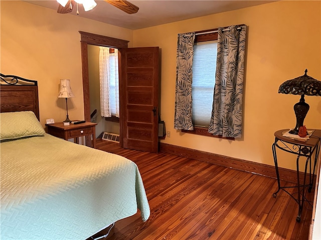 bedroom featuring hardwood / wood-style floors and ceiling fan