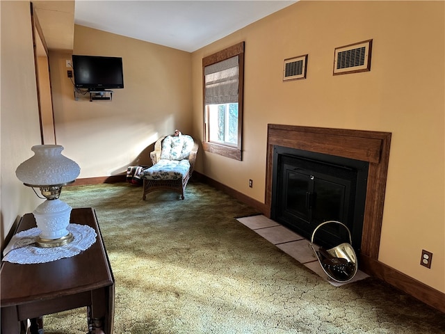 sitting room featuring carpet flooring