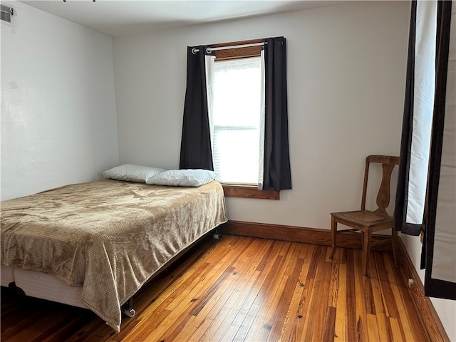 bedroom with wood-type flooring