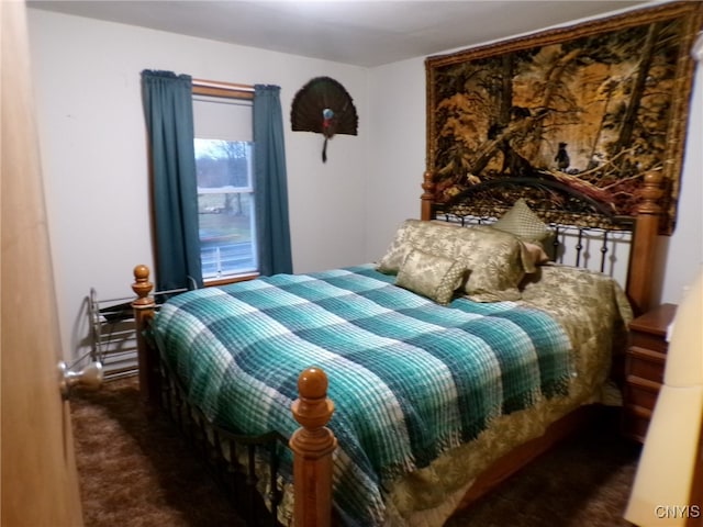 bedroom featuring dark colored carpet