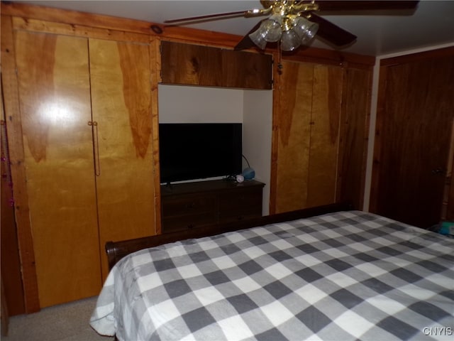 unfurnished bedroom with ceiling fan, a closet, and carpet floors