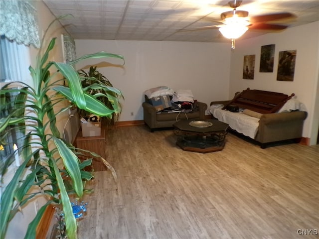 sitting room featuring hardwood / wood-style floors and ceiling fan