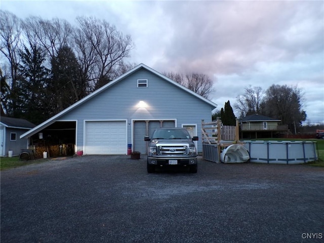 view of property exterior with a garage and a carport