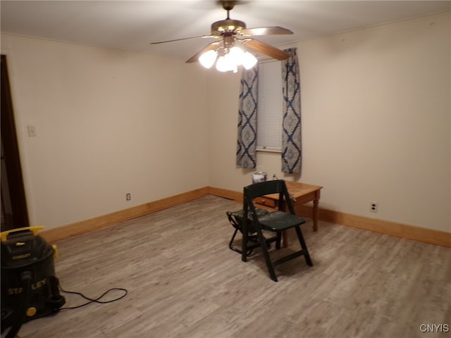 miscellaneous room featuring hardwood / wood-style floors, ceiling fan, and crown molding