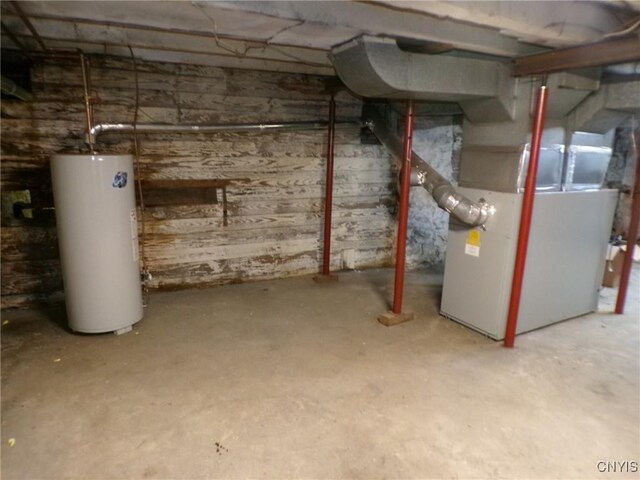 basement with heating unit and water heater