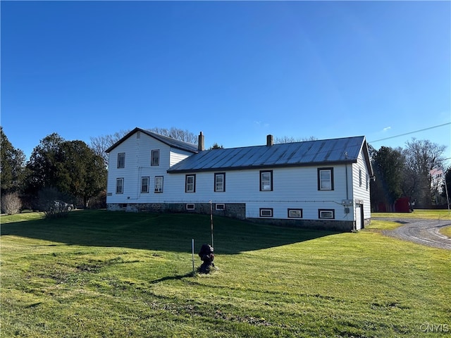 view of front of house with a garage and a front lawn