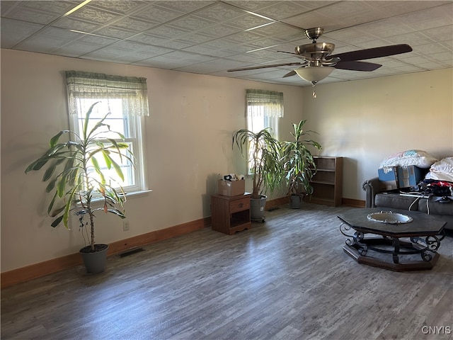 sitting room with hardwood / wood-style flooring and ceiling fan