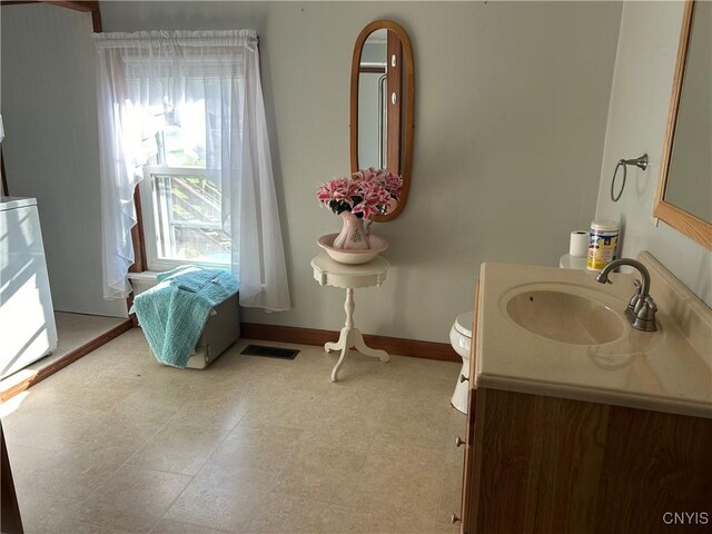 bathroom with vanity and toilet