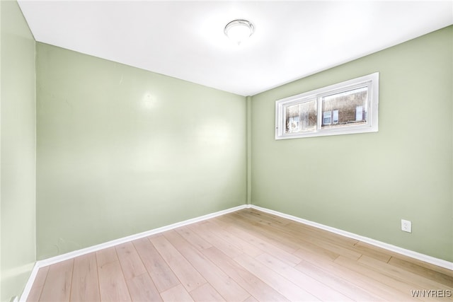 unfurnished room with light hardwood / wood-style floors