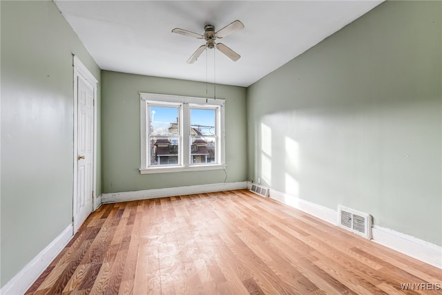 unfurnished room featuring ceiling fan and hardwood / wood-style flooring