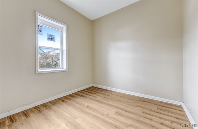 spare room featuring light wood-type flooring