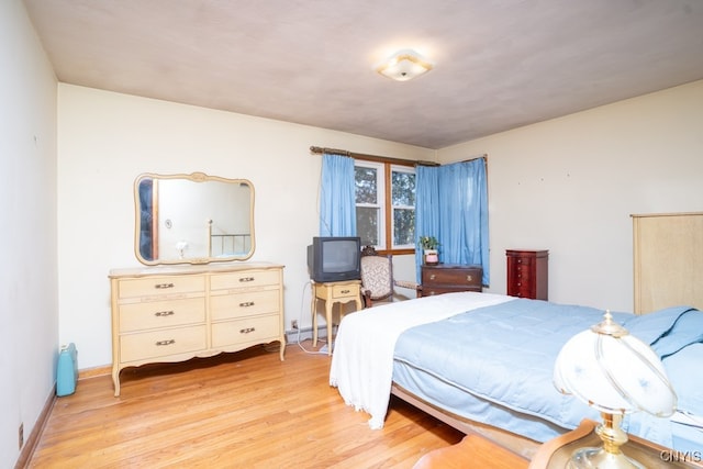 bedroom with light hardwood / wood-style floors