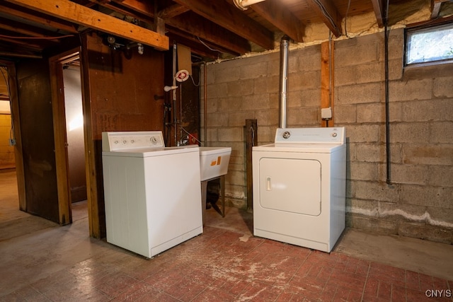 clothes washing area with independent washer and dryer