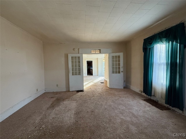 unfurnished room with carpet flooring