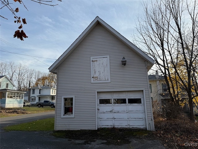 view of side of property with a garage