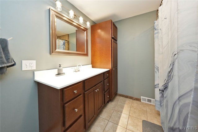 bathroom with vanity and tile patterned floors