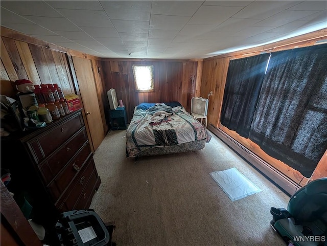 unfurnished bedroom featuring light carpet and wood walls