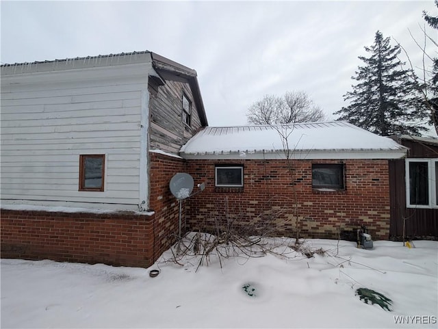 view of snow covered property