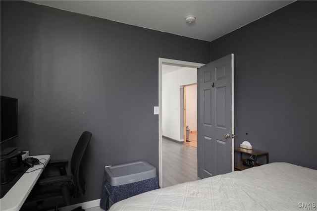 bedroom with hardwood / wood-style flooring