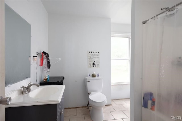 bathroom with tile patterned floors, vanity, toilet, and a shower with shower curtain