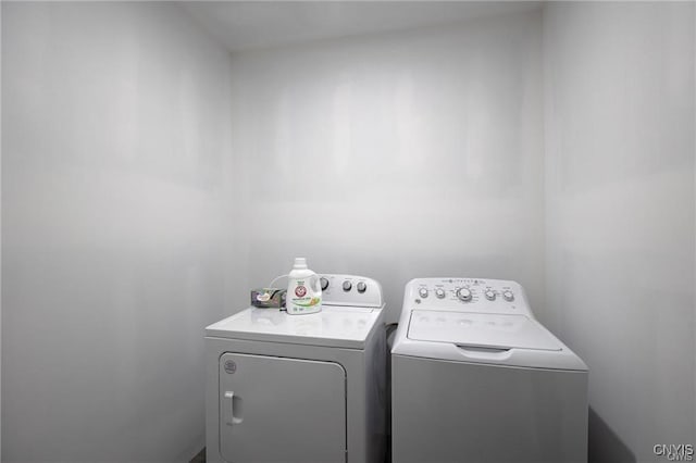 laundry room with separate washer and dryer