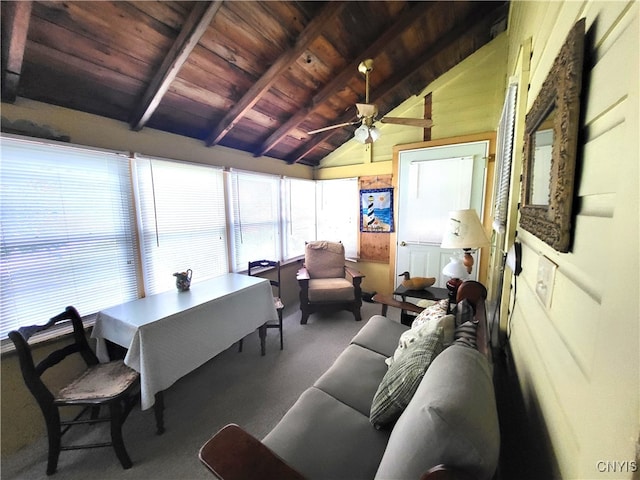 sunroom featuring vaulted ceiling with beams, ceiling fan, and wooden ceiling