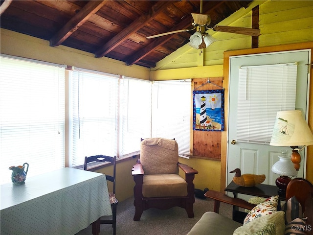 interior space featuring vaulted ceiling with beams, plenty of natural light, ceiling fan, and wood ceiling