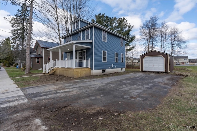 view of home's exterior with an outbuilding, a porch, and a garage