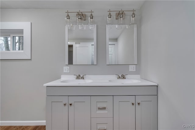 bathroom featuring hardwood / wood-style flooring and vanity