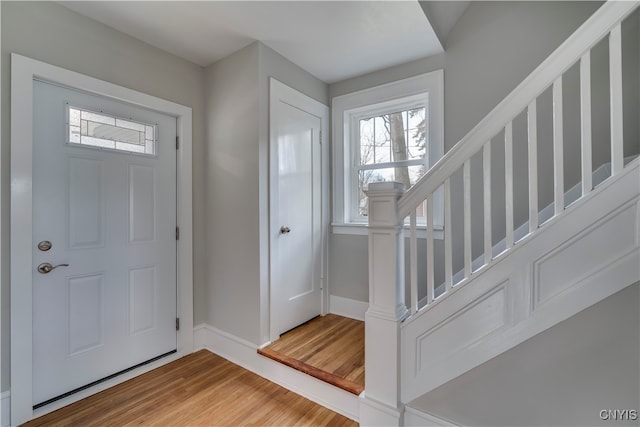 foyer entrance with hardwood / wood-style flooring