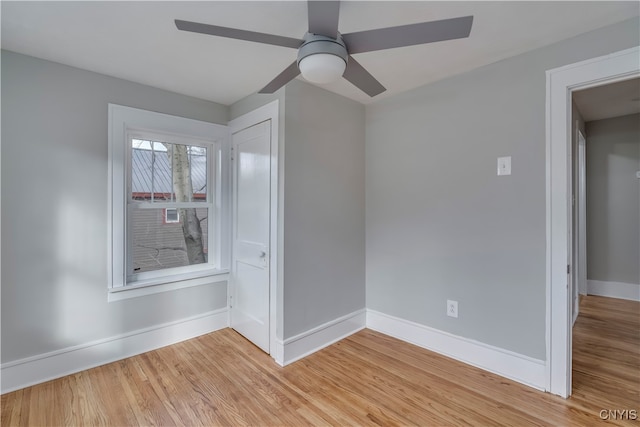 unfurnished room featuring light wood-type flooring and ceiling fan