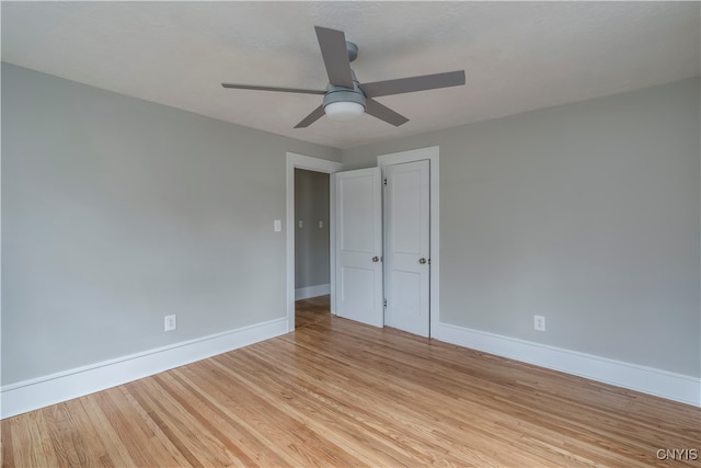 unfurnished bedroom with light hardwood / wood-style floors and ceiling fan