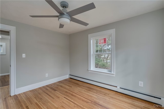 spare room with light wood-type flooring, baseboard heating, and ceiling fan