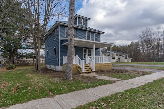 view of front of house with a porch and a front lawn