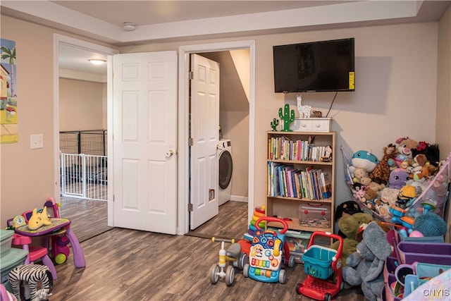 recreation room featuring washer / dryer and wood-type flooring