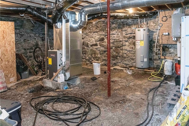 basement with heating unit and electric water heater