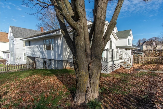 view of property exterior featuring a deck