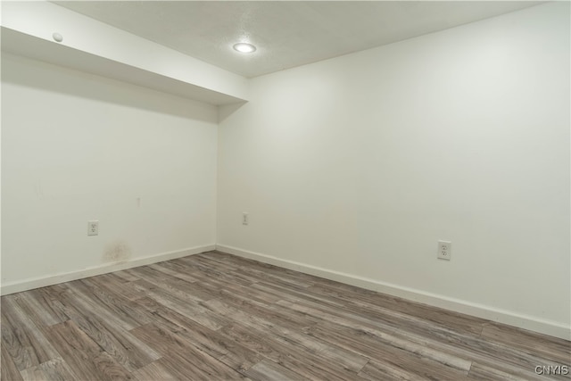 empty room with wood-type flooring