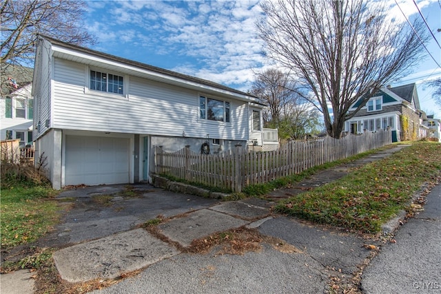 view of side of property with a garage