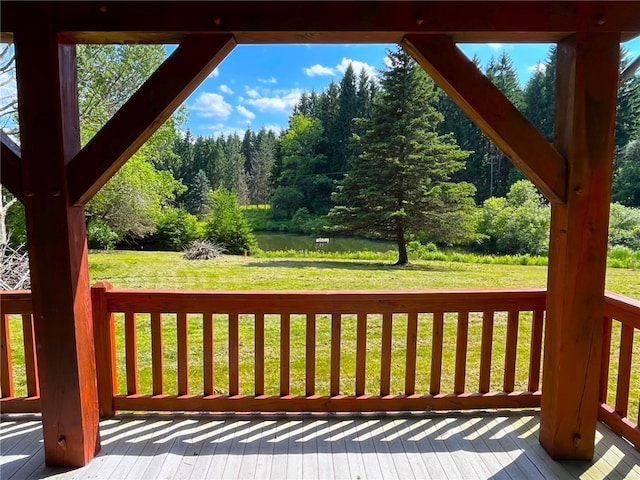 wooden deck with a lawn