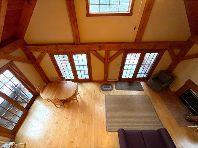 unfurnished living room with a healthy amount of sunlight and a towering ceiling