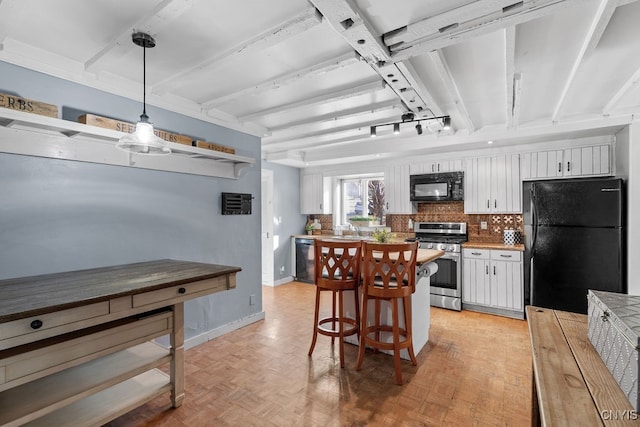 kitchen with light parquet floors, sink, black appliances, decorative light fixtures, and white cabinets