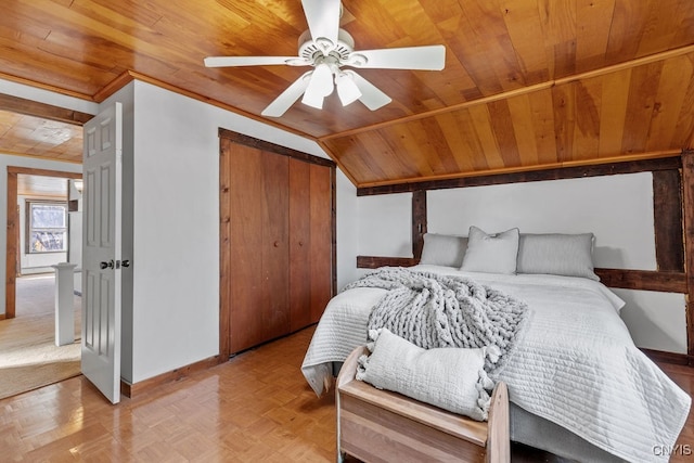 bedroom with light parquet floors, ceiling fan, wooden ceiling, a closet, and lofted ceiling