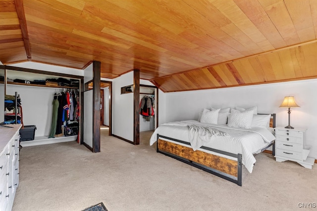 bedroom with a closet, wood ceiling, and vaulted ceiling