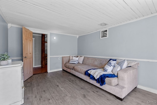 living room with light wood-type flooring, crown molding, and wooden ceiling