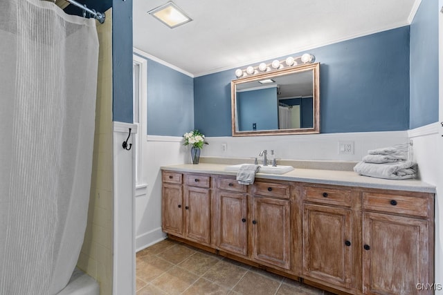 bathroom featuring shower / bath combo with shower curtain, vanity, tile patterned floors, and crown molding