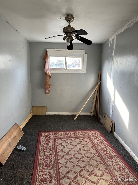 carpeted empty room with ceiling fan