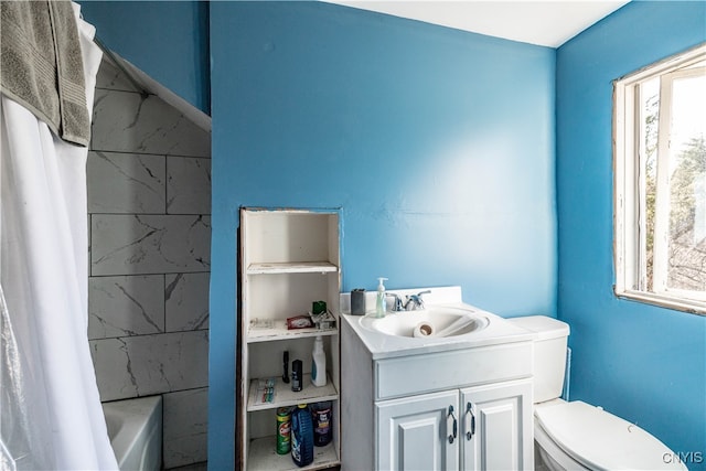 full bathroom with vanity, shower / bathtub combination with curtain, toilet, and a wealth of natural light